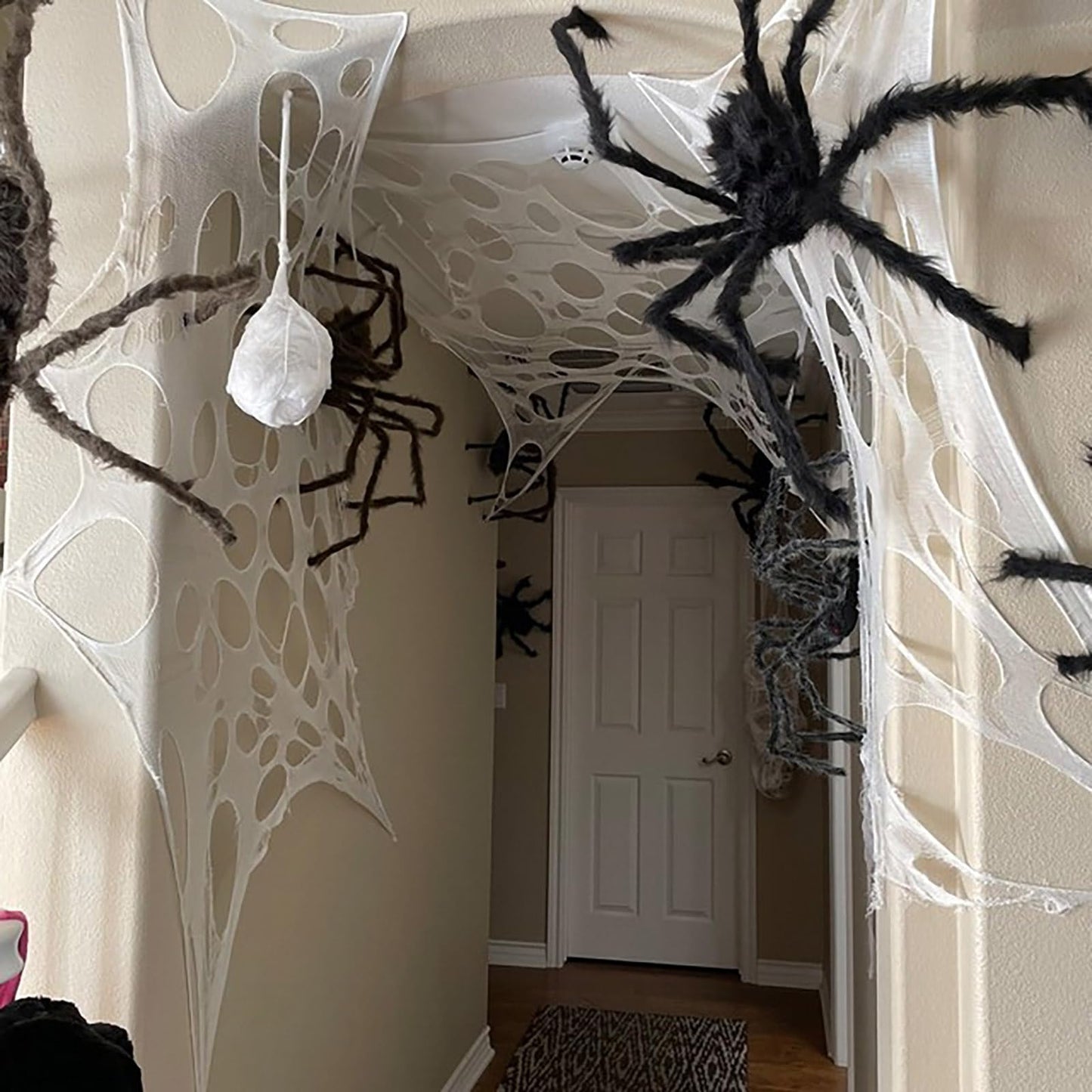 CESOF Giant Beef Netting Spider Web Halloween Decorations, Pre-Cut Spiderwebs Super Stretchy DIY Spider Webbing with Stakes, Gauze Cobwebs for Haunted House Yard Garden Party Outdoor Decor(1)